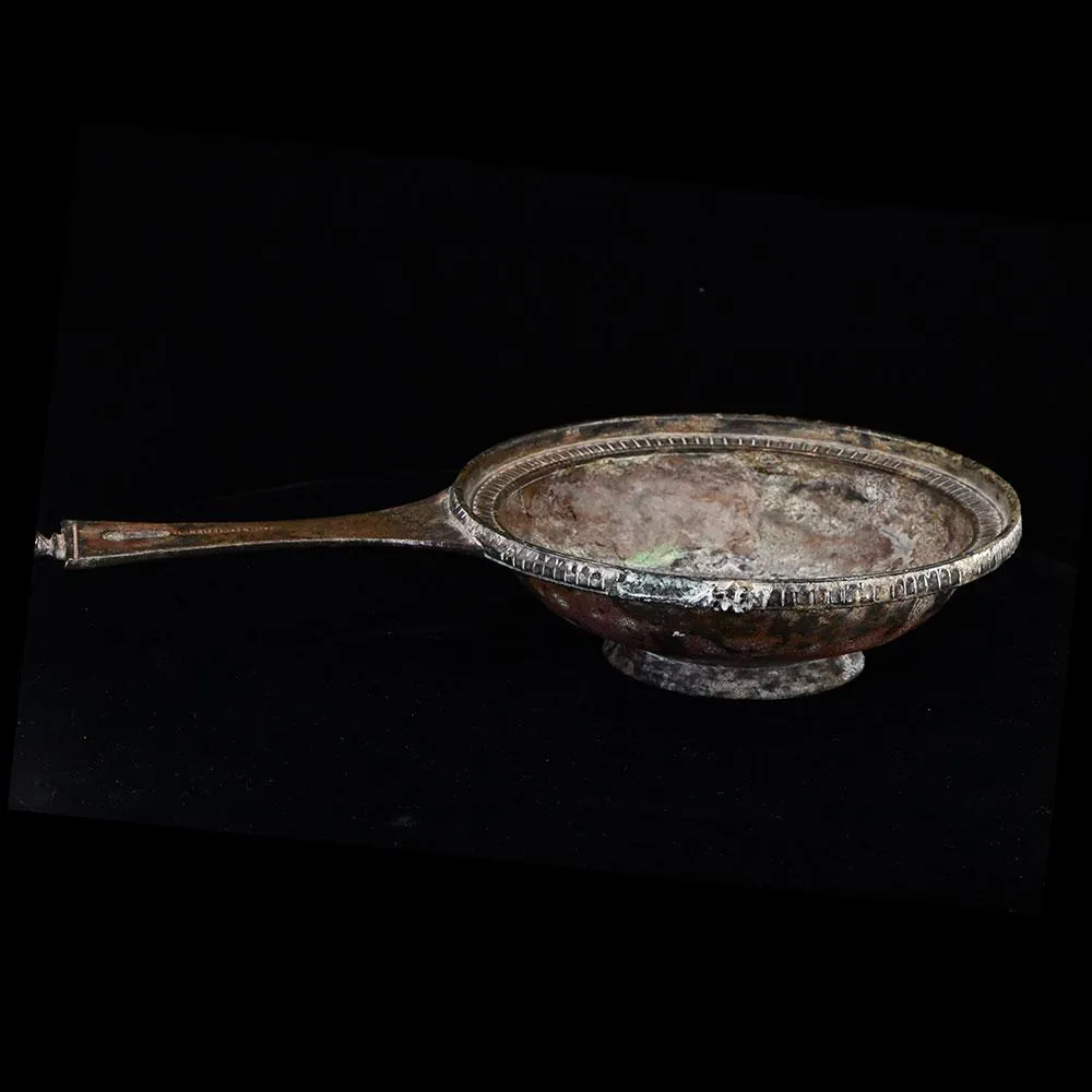 A Roman Military bronze Skillet with maker mark of Publius Cipius Polybius, Flavian Period (65-85 CE)