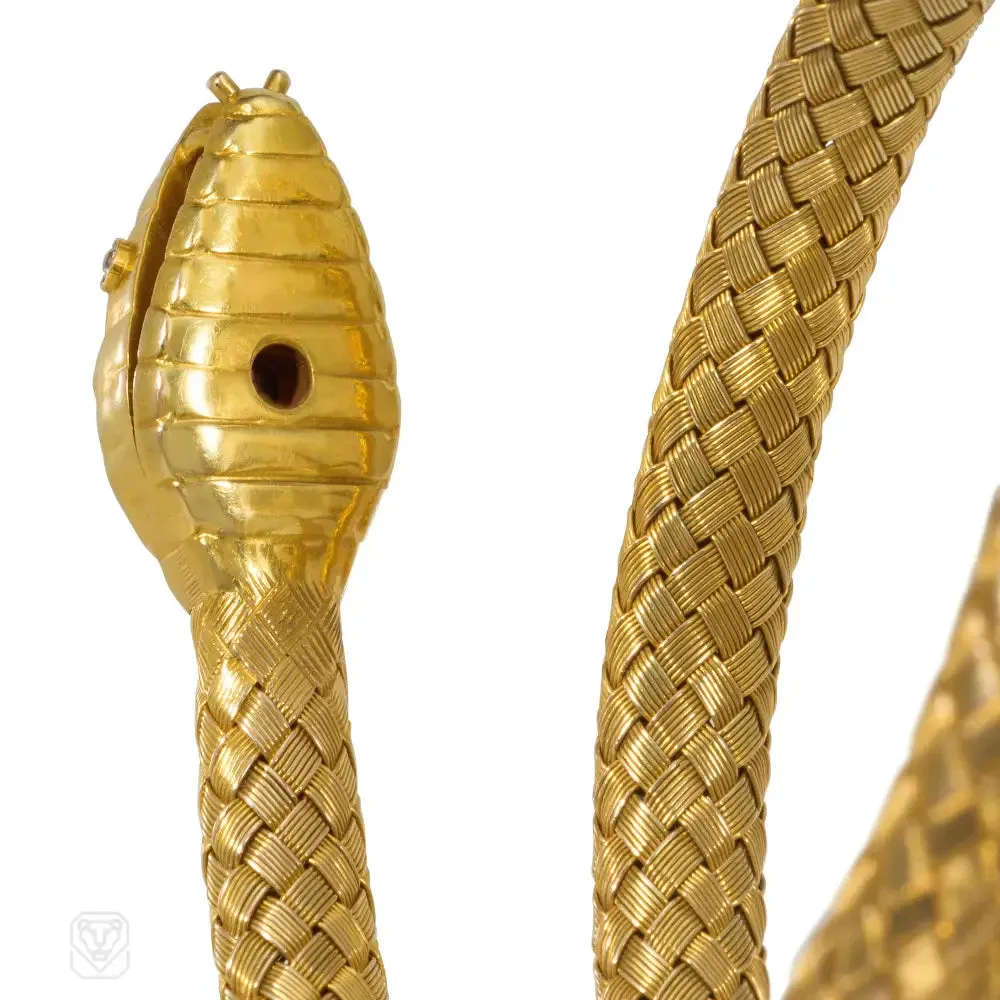 Antique woven gold coiled snake bracelet with gemset head